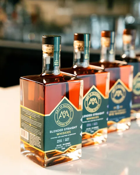 The Archive Collection lined up along the bar, Blend No. 1 nearest the camera and the rest of the bottles receding behind it.